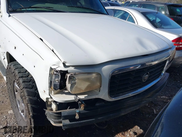 2000 Cadillac Escalade z VIN 1GYEK63R7YR226034, wystawiony jako IAAI lot #41224406 z przebiegiem 293 123 mil mil oraz . Historia ofert i sprzedaży dostępna na DreamBid. Obrazek 6.
