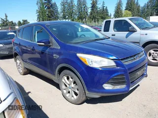 2013 Ford Escape SEL with VIN 1FMCU9HX3DUB97778, listed as a IAAI auction lot 42195445 with 147,154 mi miles. Bid and sale history available at carsss.com. Image 1.