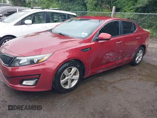 2015 Kia Optima LX with VIN 5XXGM4A7XFG455242, listed as a IAAI auction lot 42501654 with 139,209 mi miles and . Bid and sale history available at DreamBid. Image 2.