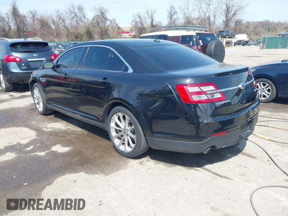 2014 Ford Taurus Limited with VIN 1FAHP2F80EG104984, listed as a IAAI auction lot 41910463 with 174,034 mi miles. Bid and sale history available at carsss.com. Image 3.