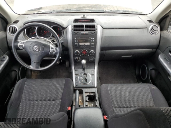 2008 Suzuki Grand Vitara w/Spare & Cargo Covers with VIN JS3TD941784100899, listed as a Copart auction lot 62581725 with 104,502 mi miles and Salvage title. Bid and sale history available at DreamBid. Image 8.