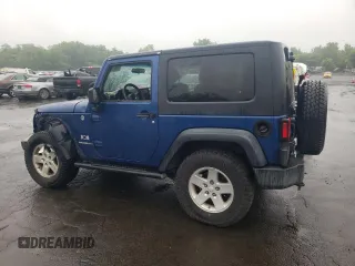 2009 Jeep Wrangler X with VIN 1J4FA24109L712701, listed as a Copart auction lot 60800855 with 156,709 mi miles and Salvage title. Bid and sale history available at DreamBid. Image 2.