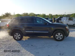 2012 Jeep Grand Cherokee Laredo with VIN 1C4RJFAG5CC234382, listed as a IAAI auction lot 42010153 with 185,078 mi miles. Bid and sale history available at carsss.com. Image 13.