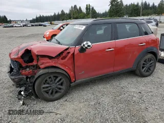 2014 MINI Countryman S with VIN WMWZC5C5XEWP36237, listed as a Copart auction lot 63120815 with 106,273 mi miles and Salvage title. Bid and sale history available at DreamBid. Image 1.
