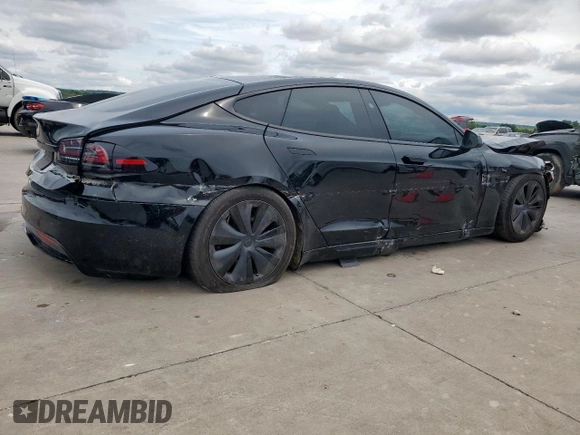 2023 Tesla Model S with VIN 5YJSA1E59PF512318, listed as a Copart auction lot 58377895 with 34,402 mi miles and Salvage title. Bid and sale history available at DreamBid. Image 3.