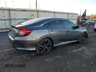 2019 Honda Civic Sport with VIN 2HGFC2F84KH507235, listed as a Copart auction lot 82616034 with 95,751 mi miles and Salvage title. Bid and sale history available at DreamBid. Image 3.