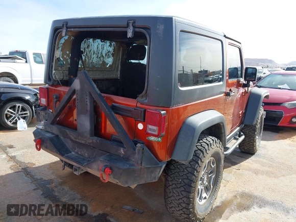 2014 Jeep Wrangler Rubicon with VIN 1C4BJWCG8EL185597, listed as a IAAI auction lot 41914489 with 85,545 mi miles and . Bid and sale history available at DreamBid. Image 4.