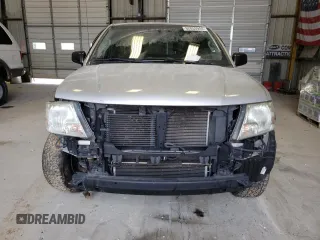 2015 Nissan Frontier SV with VIN 1N6BD0CT1FN713999, listed as a Copart auction lot 62053944 with 104,667 mi miles and Salvage title. Bid and sale history available at DreamBid. Image 5.