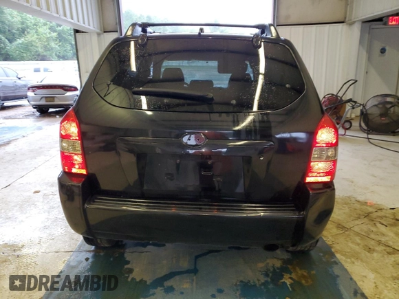 2005 Hyundai Tucson GL with VIN KM8JM12BX5U205060, listed as a Copart auction lot 71282644 with 243,076 mi miles and Salvage Title. Bid and sale history available at carsss.com. Image 6.