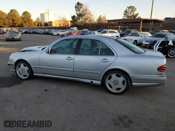 2000 Mercedes-Benz E-Class with VIN WDBJF70JXYB113988, listed as a Copart auction lot 86325514 with 198,321 mi miles and Salvage Title. Bid and sale history available at carsss.com. Image 2.