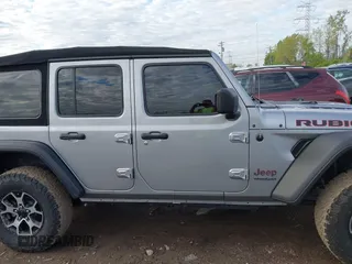 2021 Jeep Wrangler Unlimited Rubicon with VIN 1C4HJXFNXMW560512, listed as a IAAI auction lot 42124812 with 18,034 mi miles and . Bid and sale history available at DreamBid. Image 14.