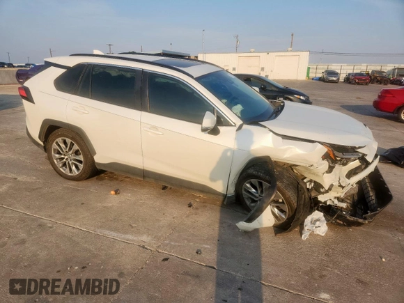 2022 Toyota RAV4 XLE Premium with VIN 2T3A1RFV7NW267132, listed as a Copart auction lot 57172245 with 21,350 mi miles and Salvage title. Bid and sale history available at DreamBid. Image 4.