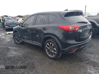 2016 Mazda CX-5 Grand Touring z VIN JM3KE4DY5G0742686, wystawiony jako IAAI lot #41598719 z przebiegiem 117 643 mil mil oraz . Historia ofert i sprzedaży dostępna na DreamBid. Obrazek 3.