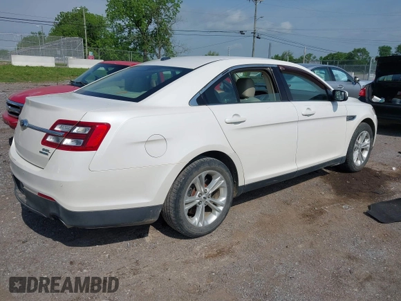 2014 Ford Taurus SEL with VIN 1FAHP2E84EG141795, listed as a IAAI auction lot 42133668 with 154,009 mi miles and . Bid and sale history available at DreamBid. Image 4.