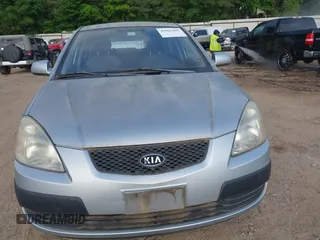 2009 Kia Rio LX with VIN KNADE243896483683, listed as a IAAI auction lot 42061404 with 88,614 mi miles. Bid and sale history available at carsss.com. Image 6.