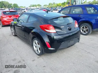 2013 Hyundai Veloster w/Gray Int with VIN KMHTC6ADXDU086856, listed as a IAAI auction lot 42503453 with 187,657 mi miles and . Bid and sale history available at DreamBid. Image 3.