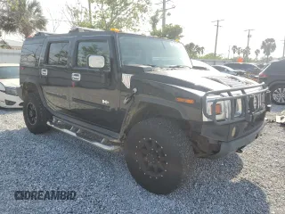 2003 Hummer H2 z VIN 5GRGN23U33H121992, wystawiony jako Copart lot #50388175 z przebiegiem 237 169 mil mil oraz Czysty tytuł • Clean title. Historia ofert i sprzedaży dostępna na DreamBid. Obrazek 4.
