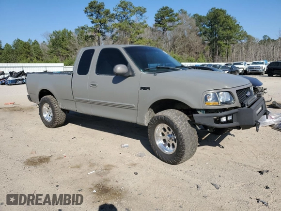 1999 Ford F-150 with VIN 1FTRX17W1XNC25527, listed as a Copart auction lot 48662525 with 150,544 mi miles and Salvage Title. Bid and sale history available at DreamBid. Image 4.