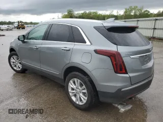 2023 Cadillac XT5 FWD Luxury z VIN 1GYKNAR47PZ144988, wystawiony jako Copart lot #50830365 z przebiegiem 17 687 mil mil oraz Szkody całkowita. Historia ofert i sprzedaży dostępna na DreamBid. Obrazek 2.