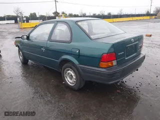 1996 Toyota Tercel DX with VIN JT2AC52L9T0127262, listed as a IAAI auction lot 41504210 with 135,732 mi miles. Bid and sale history available at carsss.com. Image 3.