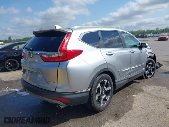 2018 Honda CR-V Touring with VIN 7FARW1H90JE012526, listed as a IAAI auction lot 42055078 with 96,098 mi miles and . Bid and sale history available at DreamBid. Image 4.