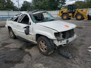 1999 Jeep Grand Cherokee Limited with VIN 1J4G268S2XC756532, listed as a Copart auction lot 71222174 with 279,300 mi miles and Salvage title. Bid and sale history available at DreamBid. Image 4.