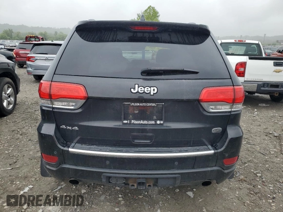 2015 Jeep Grand Cherokee Overland with VIN 1C4RJFCT2FC762573, listed as a Copart auction lot 59123275 with 229,128 mi miles and Salvage title. Bid and sale history available at DreamBid. Image 6.