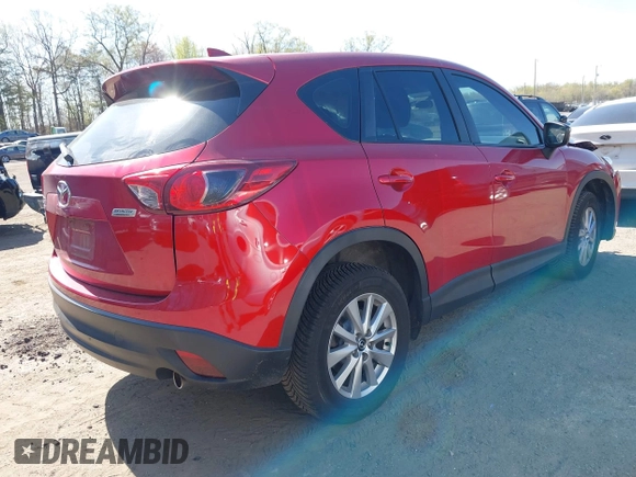 2016 Mazda CX-5 Sport with VIN JM3KE4BY7G0805631, listed as a IAAI auction lot 42028606 with 93,659 mi miles and . Bid and sale history available at carsss.com. Image 4.