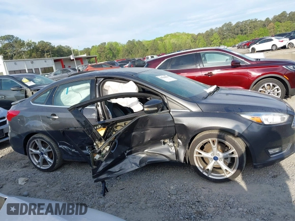 2016 Ford Focus Titanium with VIN 1FADP3J25GL282293, listed as a IAAI auction lot 41998959 with 119,781 mi miles and . Bid and sale history available at DreamBid. Image 13.