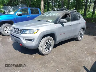 2018 Jeep Compass Trailhawk with VIN 3C4NJDDB5JT130317, listed as a IAAI auction lot 42470070 with 95,000 mi miles and . Bid and sale history available at DreamBid. Image 2.