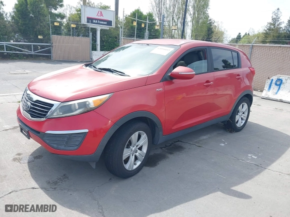 2013 Kia Sportage LX with VIN KNDPBCA26D7355889, listed as a IAAI auction lot 42054415 with 136,859 mi miles. Bid and sale history available at carsss.com. Image 2.