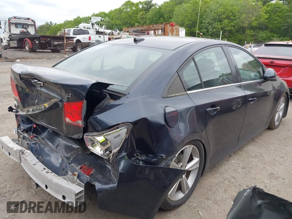 2014 Chevrolet Cruze 1LT z VIN 1G1PC5SBXE7433740, wystawiony jako IAAI lot #42282321 z przebiegiem 148 282 mil mil oraz . Historia ofert i sprzedaży dostępna na DreamBid. Obrazek 4.