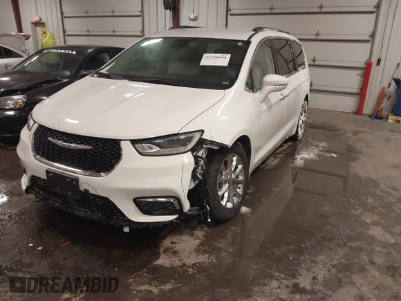 2021 Chrysler Pacifica Touring L with VIN 2C4RC1BG3MR504293, listed as a IAAI auction lot 41728608 with 70,487 mi miles and . Bid and sale history available at DreamBid. Image 17.