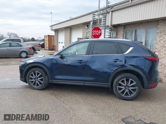 2018 Mazda CX-5 Grand Touring with VIN JM3KFADM1J1439544, listed as a IAAI auction lot 41891134 with 54,132 mi miles and . Bid and sale history available at DreamBid. Image 14.