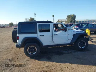 2019 Jeep Wrangler Unlimited Rubicon with VIN 1C4HJXFN7KW505383, listed as a IAAI auction lot 41220907 with 53,578 mi miles and . Bid and sale history available at DreamBid. Image 13.