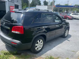2013 Kia Sorento LX with VIN 5XYKTCA65DG324775, listed as a Copart auction lot 63433705 with 128,031 mi miles and Clean title. Bid and sale history available at DreamBid. Image 4.