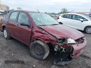 2007 Ford Focus S z VIN 1FAHP34NX7W340937, wystawiony jako IAAI lot #42369880 z przebiegiem 80 262 mil mil oraz . Historia ofert i sprzedaży dostępna na DreamBid. Obrazek 1.