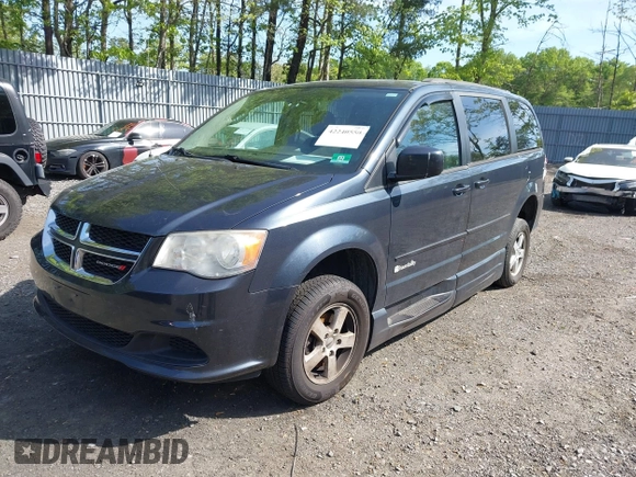 2013 Dodge Grand Caravan SXT with VIN 2C4RDGCG4DR636798, listed as a IAAI auction lot 42240550 with 96,100 mi miles and . Bid and sale history available at DreamBid. Image 2.