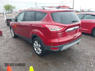 2014 Ford Escape Titanium with VIN 1FMCU0JX3EUD98815, listed as a IAAI auction lot 42078367 with 124,680 mi miles. Bid and sale history available at carsss.com. Image 3.