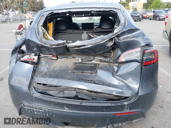 2022 Tesla Model Y Performance with VIN 7SAYGDEF7NF563433, listed as a IAAI auction lot 41713557 with Not Provided miles and . Bid and sale history available at DreamBid. Image 6.