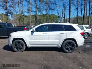 2015 Jeep Grand Cherokee Altitude with VIN 1C4RJFAG4FC924869, listed as a IAAI auction lot 41656444 with 112,786 mi miles. Bid and sale history available at carsss.com. Image 14.