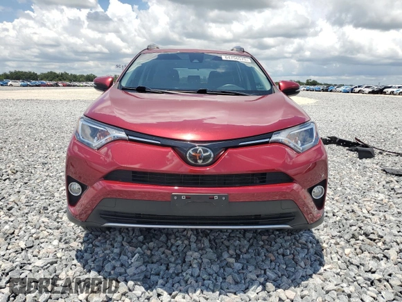 2018 Toyota RAV4 XLE with VIN 2T3WFREV7JW477541, listed as a Copart auction lot 64756575 with 59,779 mi miles and Salvage title. Bid and sale history available at DreamBid. Image 5.