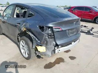 2023 Tesla Model Y Long Range with VIN 7SAYGDEEXPA078629, listed as a IAAI auction lot 42046354 with 27,245 mi miles and . Bid and sale history available at DreamBid. Image 6.