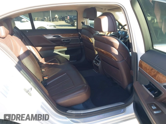 2018 BMW 7 Series 750i with VIN WBA7F0C57JGM23667, listed as a IAAI auction lot 41581035 with 113,140 mi miles and . Bid and sale history available at DreamBid. Image 8.