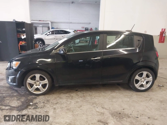 2016 Chevrolet Sonic LTZ z VIN 1G1JE6SB3G4150803, wystawiony jako IAAI lot #42007951 z przebiegiem 124 811 mil mil oraz . Historia ofert i sprzedaży dostępna na DreamBid. Obrazek 14.