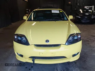 2006 Hyundai Tiburon GT z VIN KMHHN65F56U225936, wystawiony jako IAAI lot #41695280 z przebiegiem 121 110 mil mil oraz . Historia ofert i sprzedaży dostępna na DreamBid. Obrazek 12.
