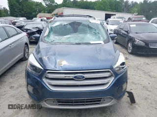 2018 Ford Escape Titanium with VIN 1FMCU0J99JUA12717, listed as a IAAI auction lot 42237509 with 123,896 mi miles and . Bid and sale history available at DreamBid. Image 6.