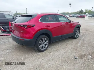 2023 Mazda CX-30 S Premium with VIN 3MVDMBDM3PM511402, listed as a IAAI auction lot 42180001 with 6,189 mi miles and . Bid and sale history available at DreamBid. Image 4.