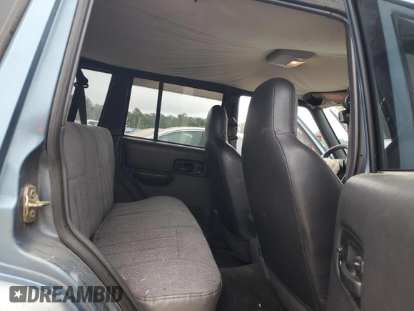 1999 Jeep Cherokee Sport с VIN 1J4FT68S9XL552299, выставлен на аукционе Copart как лот 58045135 с пробегом Не указан миль и Списание • Salvage title. История ставок и продаж доступна на DreamBid. Изображение 10.