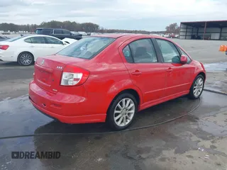 2009 Suzuki SX4 Sport FWD with VIN JS2YC414596200021, listed as a IAAI auction lot 40753192 with 144,805 mi miles and . Bid and sale history available at DreamBid. Image 4.